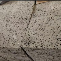 红外线切割火山石墙砖 黑色蜂窝洞石 支持定制厂家 卓轩建材